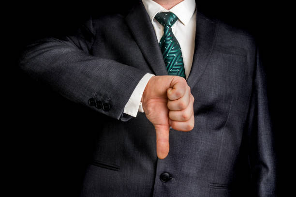istock Businessman showing gesture with thumb down 639324274