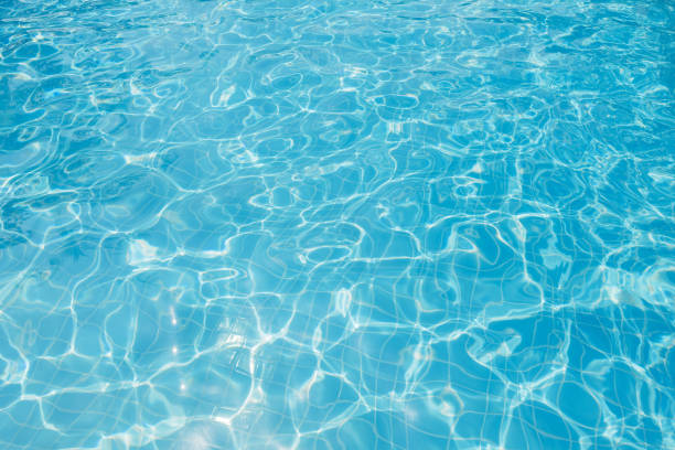 istock Ripple water in swimming pool with sun reflection 639324288