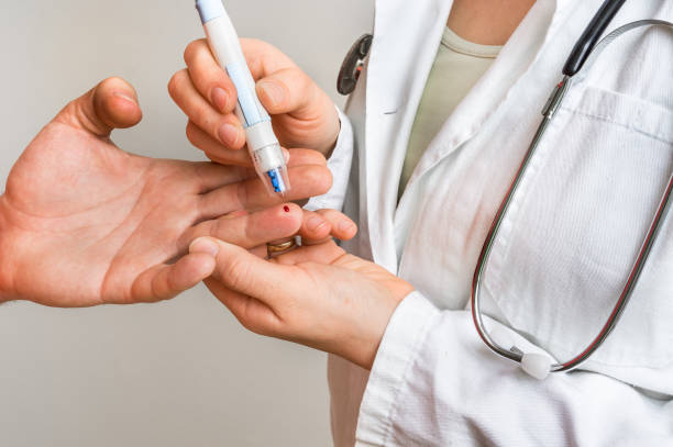 istock Measuring blood sugar on finger - diabetes concept 639325102