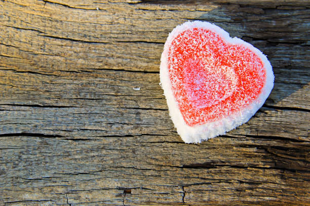 istock Heart shaped cake on wooden background 639326502