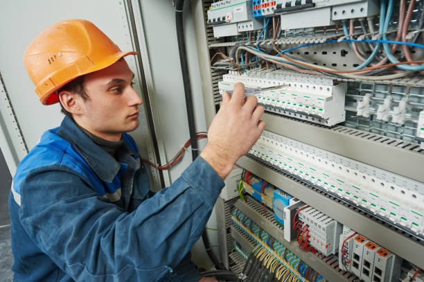 istock electrician works with electric meter tester in fuse box 639327028