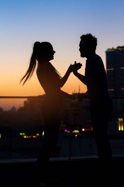 istock Couple on sunset sky background. 639328106