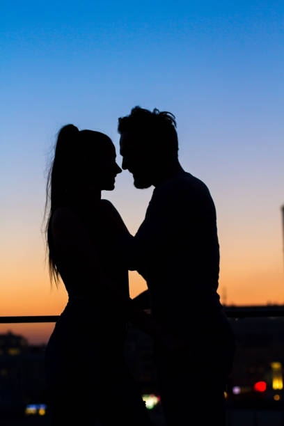 istock Couple and evening sky background. 639328150
