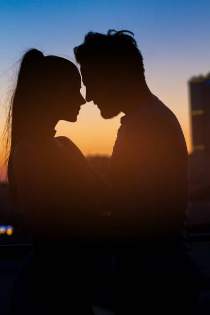 istock Couple silhouette at sunset. 639328210