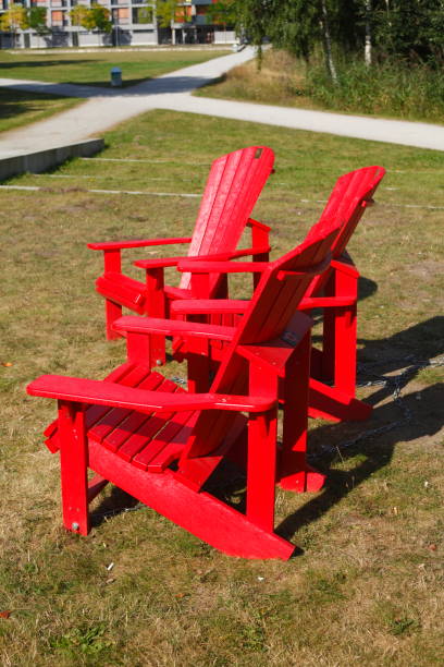 istock red wooden garden chairs on a meadow 639328892