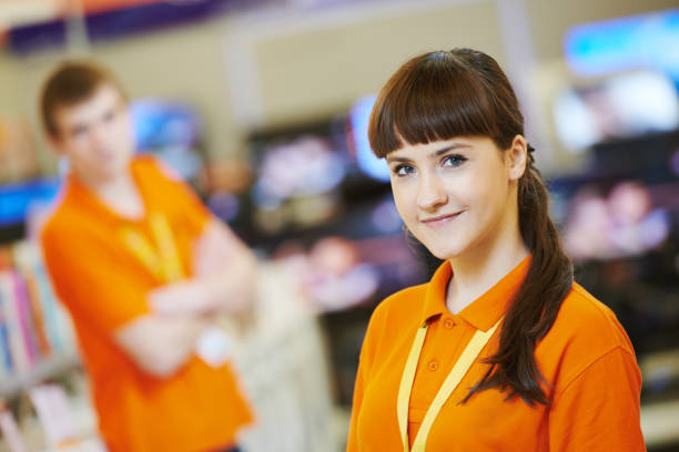 Positive woman seller or shop assistant portrait in supermarket store