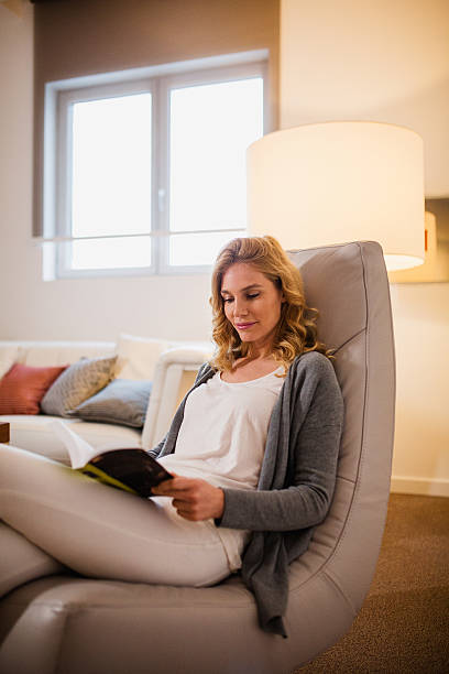istock Beautiful female reading book 639332222