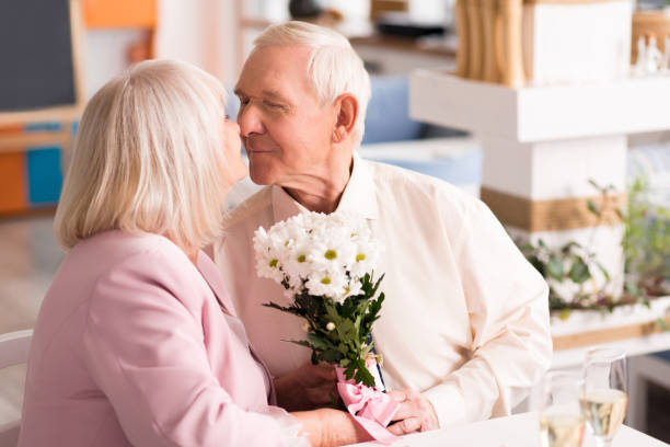 istock Adorable elderly couple kissing 639333518
