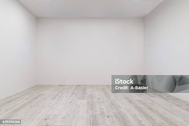 Room With Whitewashed Laminate And Newly Painted Wall Stock Photo - Download Image Now