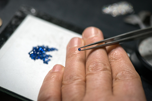 Professional gemstone settings jewellery craft laboratory: Selecting sapphire