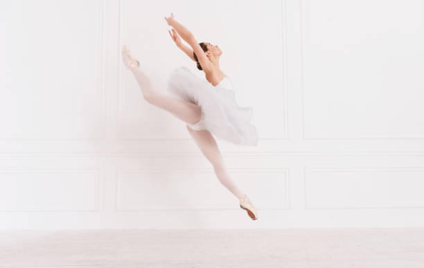 istock Tender ballerina jumping over white background 639336902