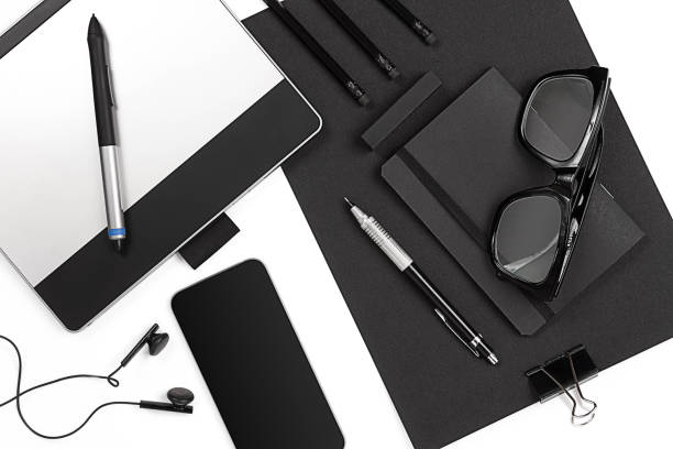 istock Blank notepad with clips, pens and glasses flat lay. 639337036