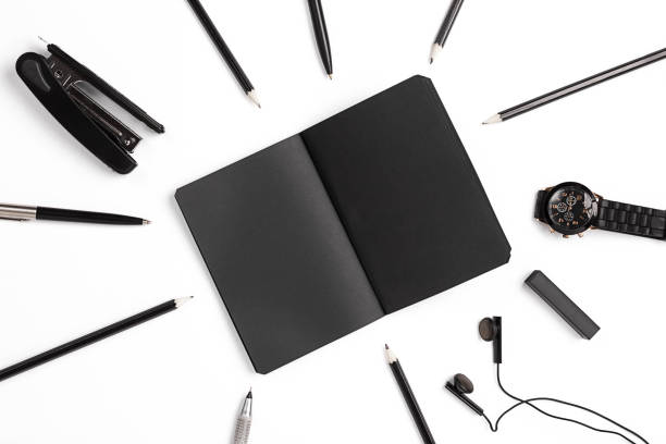 istock Blank notepad with clips, pens and glasses flat lay. 639337100