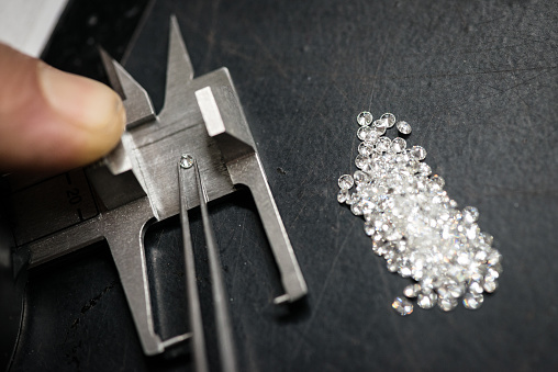 Professional gemstone settings jewellery craft laboratory: Selecting diamonds