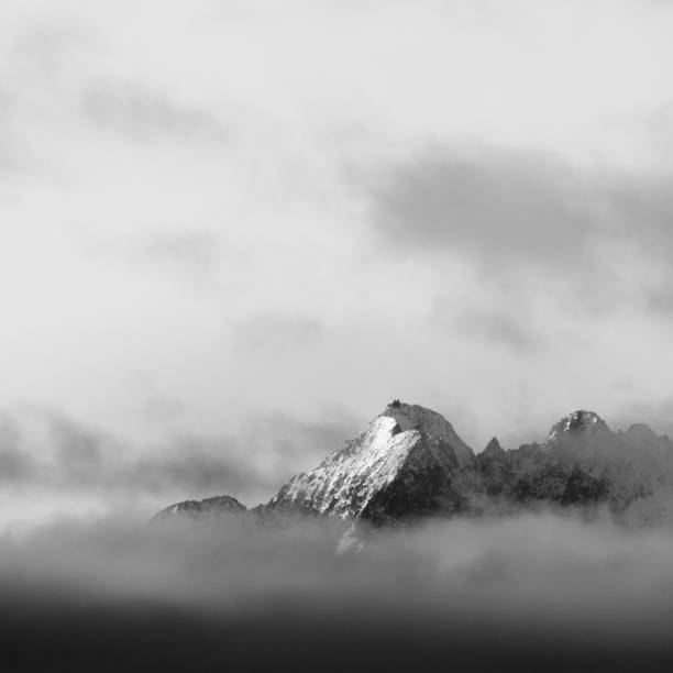 istock Ridges of Tatra mountains on clouds, black and white version. 639339344
