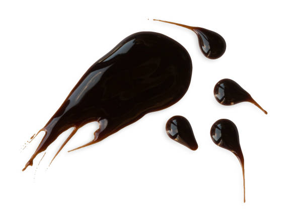 istock Drops of black savory or chocolate sauce isolated on white 639340142