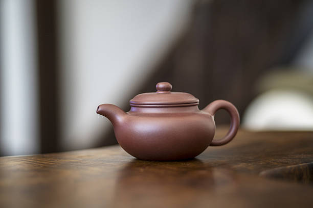 istock Chinese teapot on wooden table 639341176