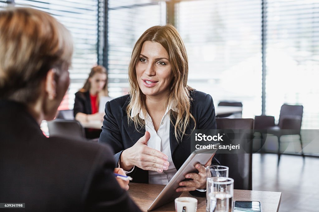 Business People at the Cafe Restaurant Advice Stock Photo