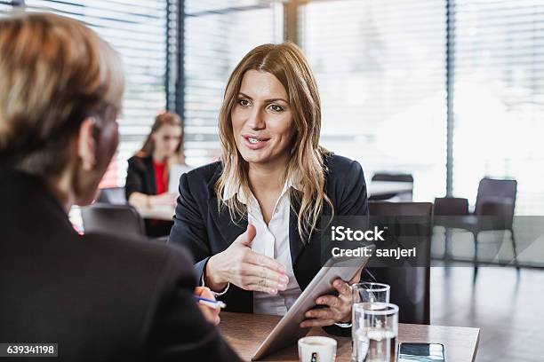 Business People At The Cafe Restaurant Stock Photo - Download Image Now - Advice, Sales Occupation, Financial Advisor