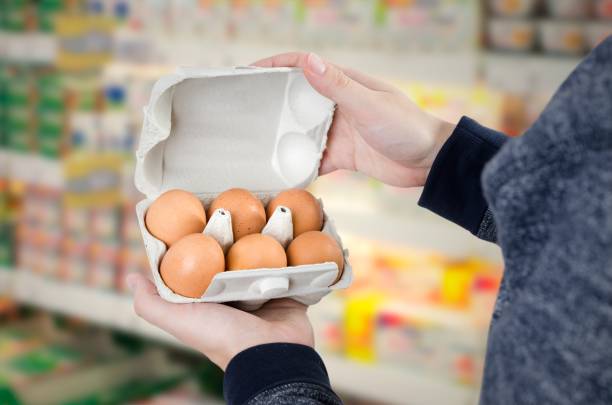 istock Man holding egg box in supermarket 639341664
