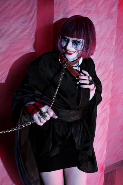 istock laughing girl with zombie makeup on leash 639342100