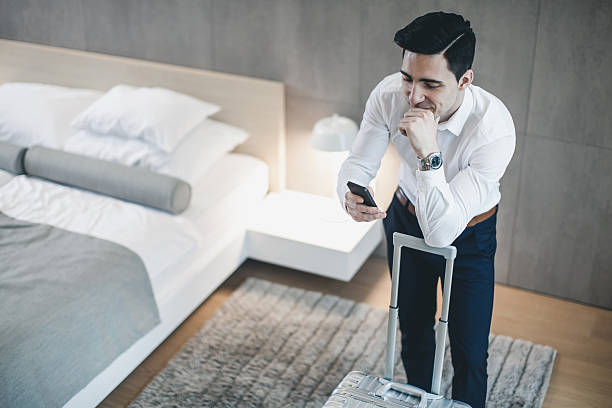 istock Businessman in a Hotel Room Using Mobile phone 639343918