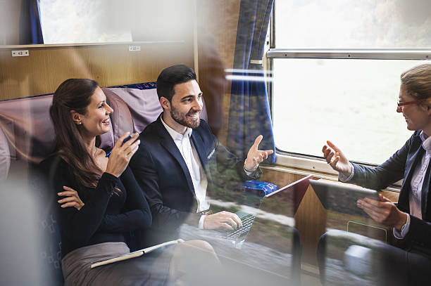 Business People Having a Meeting on a Train