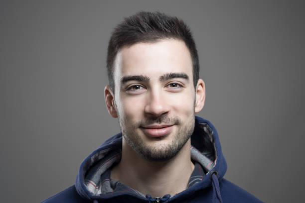 istock Positive friendly young man smiling at camera 639344618