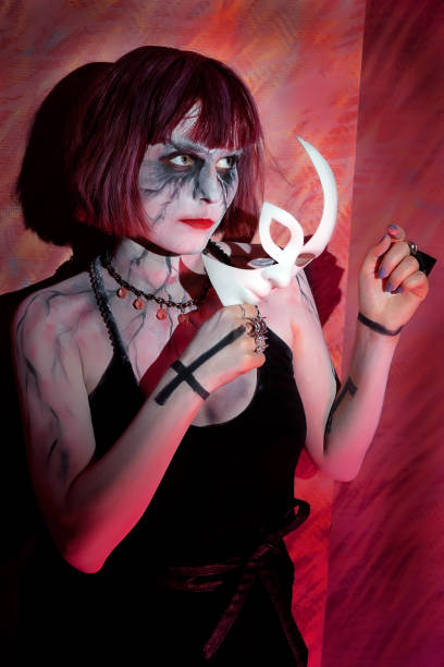 istock girl with makeup zombies and white mask 639345472