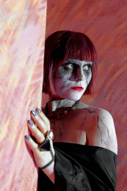 istock girl with zombie makeup on red 639346262