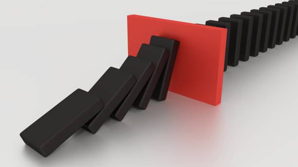 istock Falling Domino Row With Red Stop Piece On The Desk 639346658