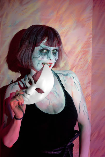 istock girl with makeup zombies and white mask 639347560