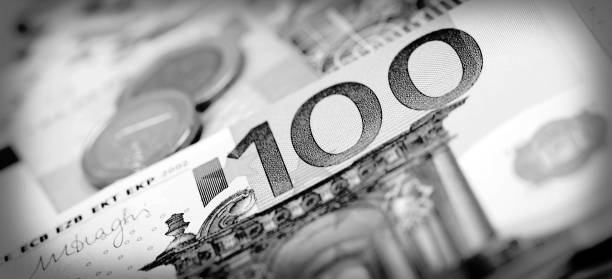 istock Closeup of banknotes and coins 639353128