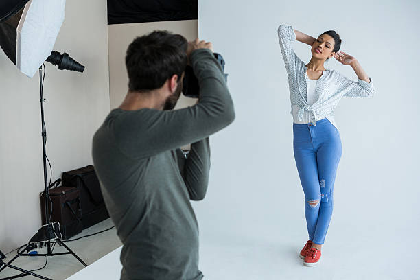 istock Female model posing for photographer 639357638