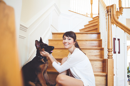Women enjoy at home with her dog