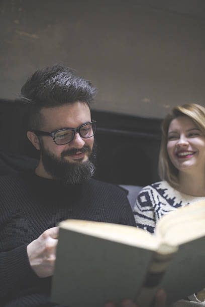 istock Hipster young couple studying together at cafe 639360926