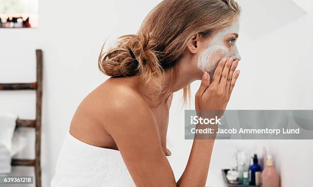 Woman Taking Care Of Her Facial Skin Stock Photo - Download Image Now - Facial Mask - Beauty Product, Mask - Disguise, Human Face