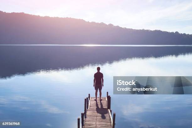 Human Strength Or Psychology Concept Man Standing On Pier Stock Photo - Download Image Now