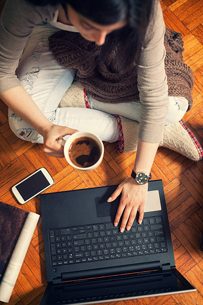 istock Woman using laptop with Camera and phone 639363762
