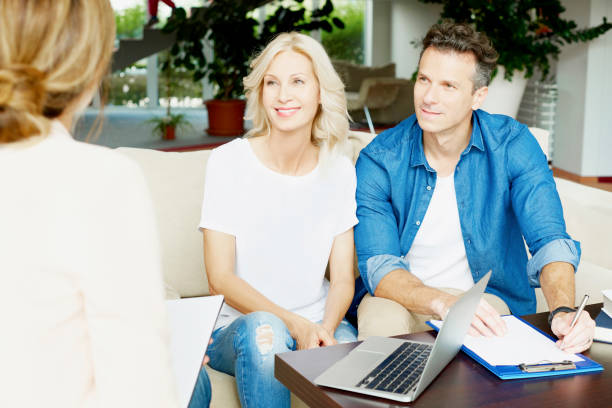 istock Real estate agent with her client 639371180
