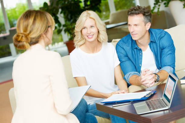 istock Insurance agent and her clients 639371378