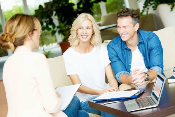 istock Insurance agent and her clients 639371570