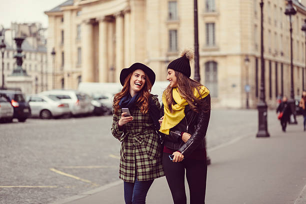 Friends enjoying Paris Young women spending time together in Paris street friends stock pictures, royalty-free photos & images