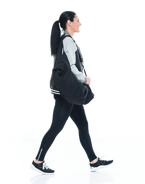 istock Smiling woman walking 639374164