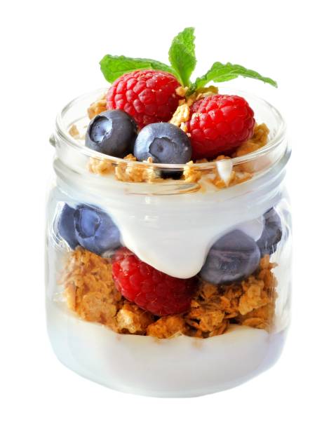 istock Blueberry, raspberry parfait in a mason jar isolated on white 639375964