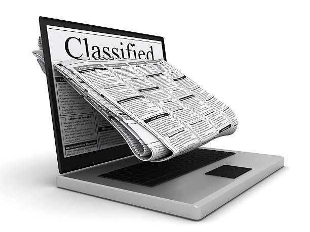 istock Internet newspaper classified ad laptop computer 639377078