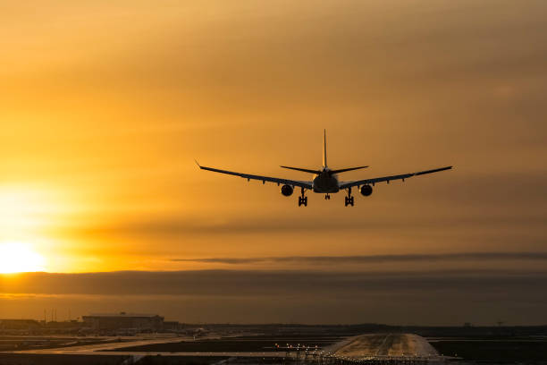 istock Airplane landing to runway 639378434