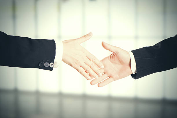 istock businessman shaking hands 639379152