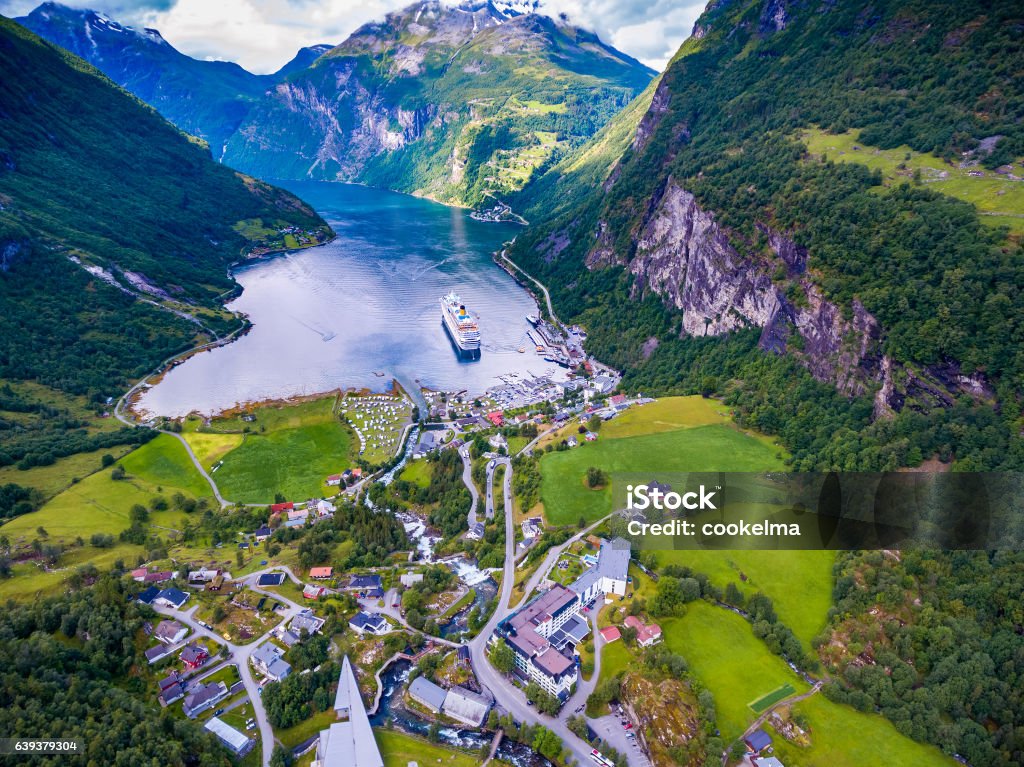 Geiranger fjord, Norway. Geiranger fjord, Beautiful Nature Norway aerial photography. It is a 15-kilometre (9.3 mi) long branch off of the Sunnylvsfjorden, which is a branch off of the Storfjorden (Great Fjord). Adventure Stock Photo