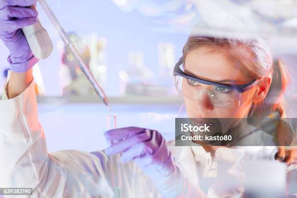 Young Scientist Pipetting In Life Science Laboratory Stock Photo - Download Image Now